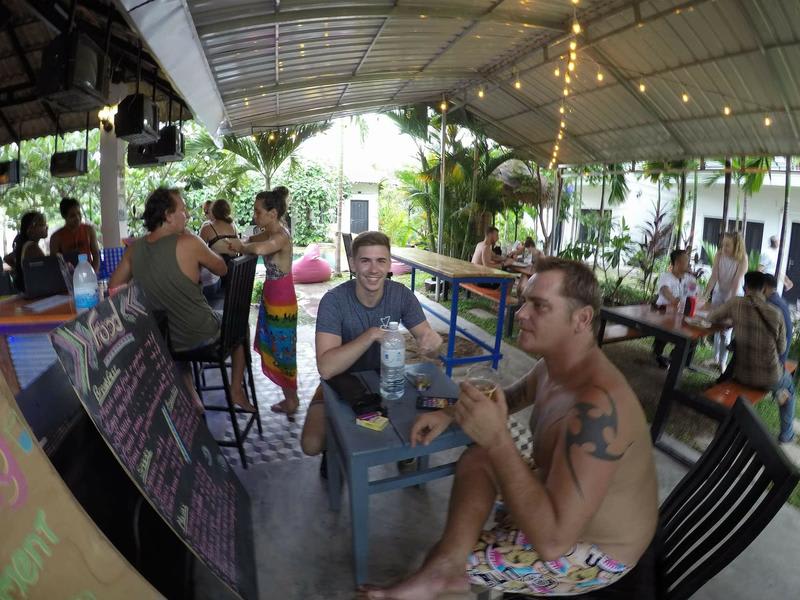 People chilling and drinking at the Bar at YOLO Hostel Siem Reap, Cambodia